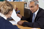 Photograph of a teacher talking to a student