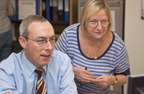 Photograph of a man and a woman in an office