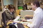 Photograph of a woman in a travel agents