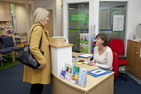 4. Photograph of a woman getting advice at a walk in community legal advice centre
